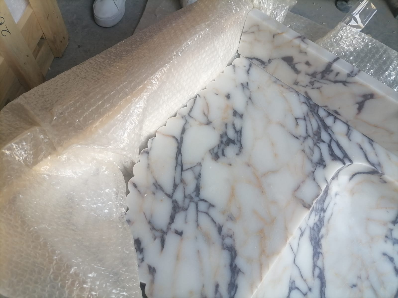 Elegant Calacatta Viola marble slab showcasing unique veining patterns and polished surface, ideal for luxurious interiors