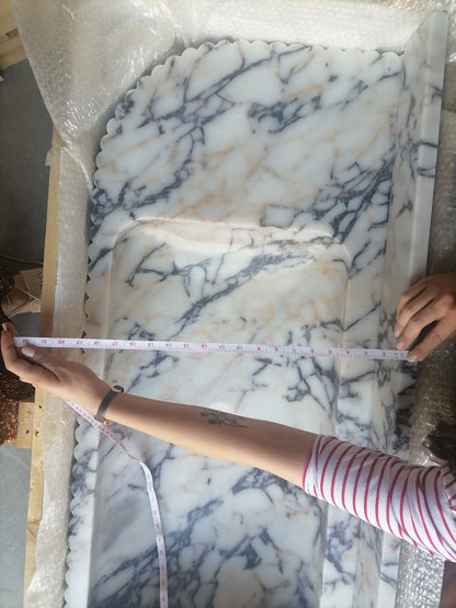 Elegant Calacatta Viola marble slab showcasing unique veining patterns and polished surface, ideal for luxurious interiors