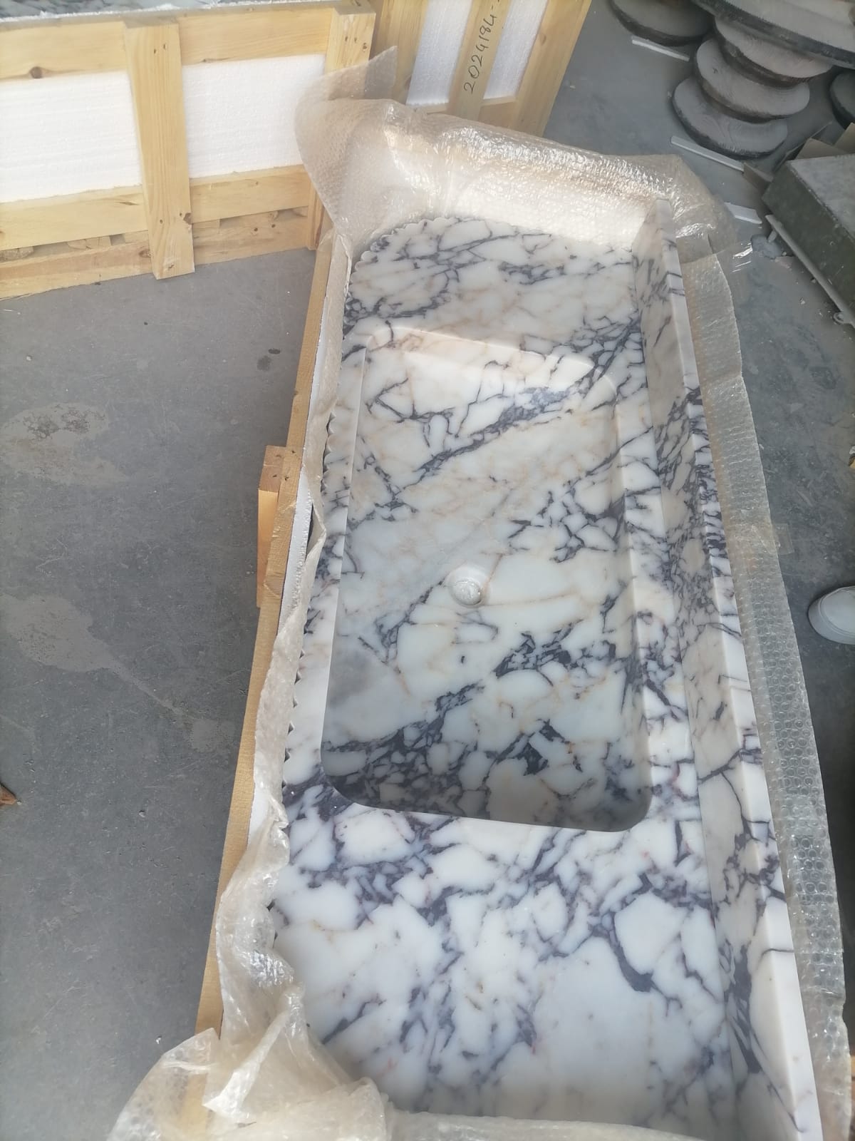 Elegant Calacatta Viola marble slab showcasing unique veining patterns and polished surface, ideal for luxurious interiors