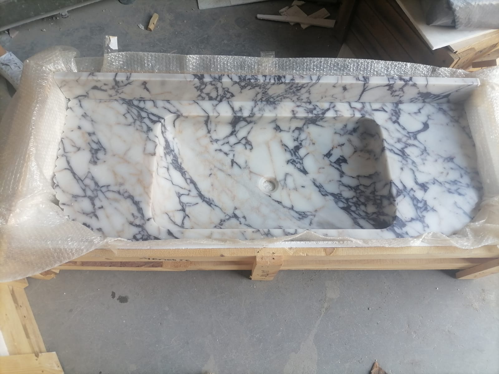 Elegant Calacatta Viola marble slab showcasing unique veining patterns and polished surface, ideal for luxurious interiors