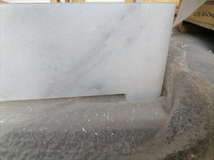 Elegant Carrara marble surface showcasing classic white and gray veining for luxurious interior designs