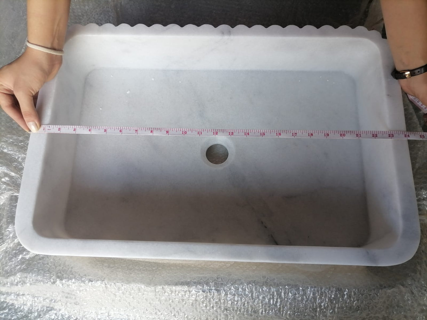 Elegant Carrara marble surface showcasing classic white and gray veining for luxurious interior designs