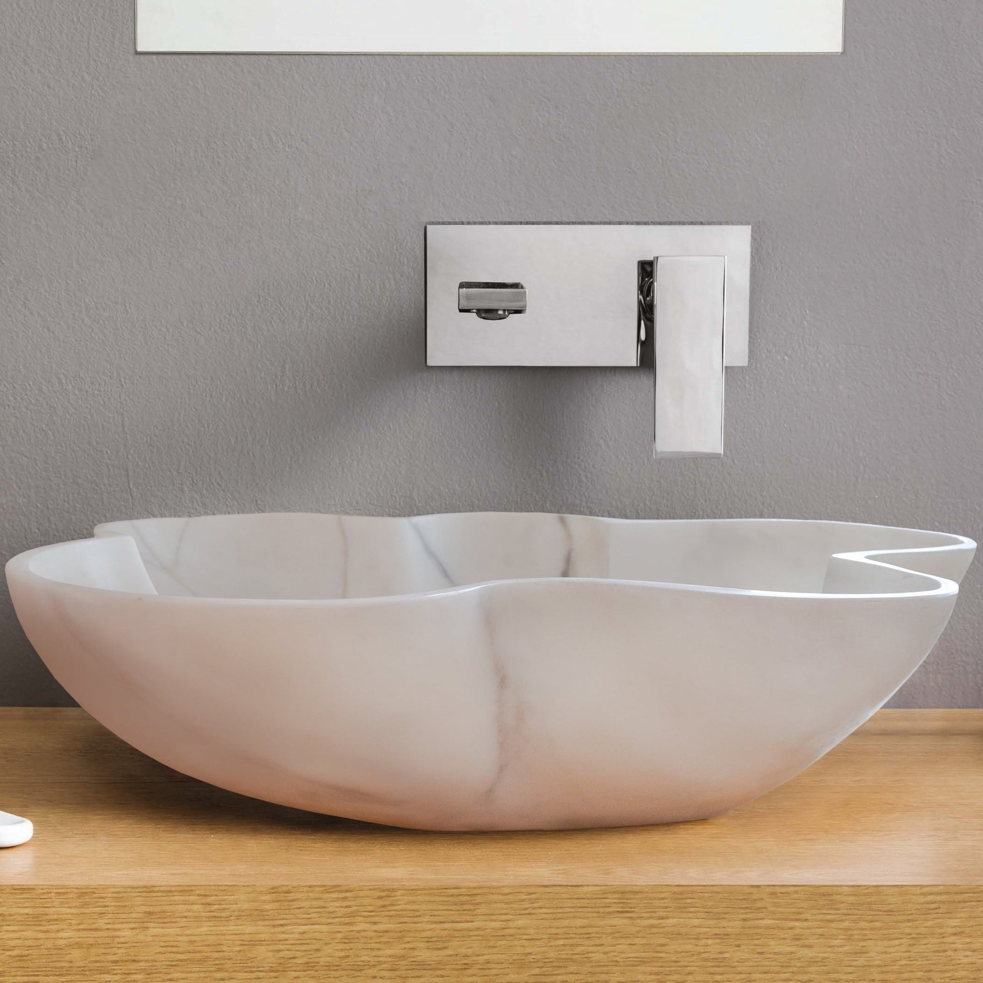 Elegant Carrara white marble vanity sink showcasing timeless luxury and sophisticated bathroom design.