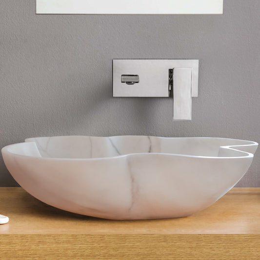 Elegant Carrara white marble vanity sink showcasing timeless luxury and sophisticated bathroom design.