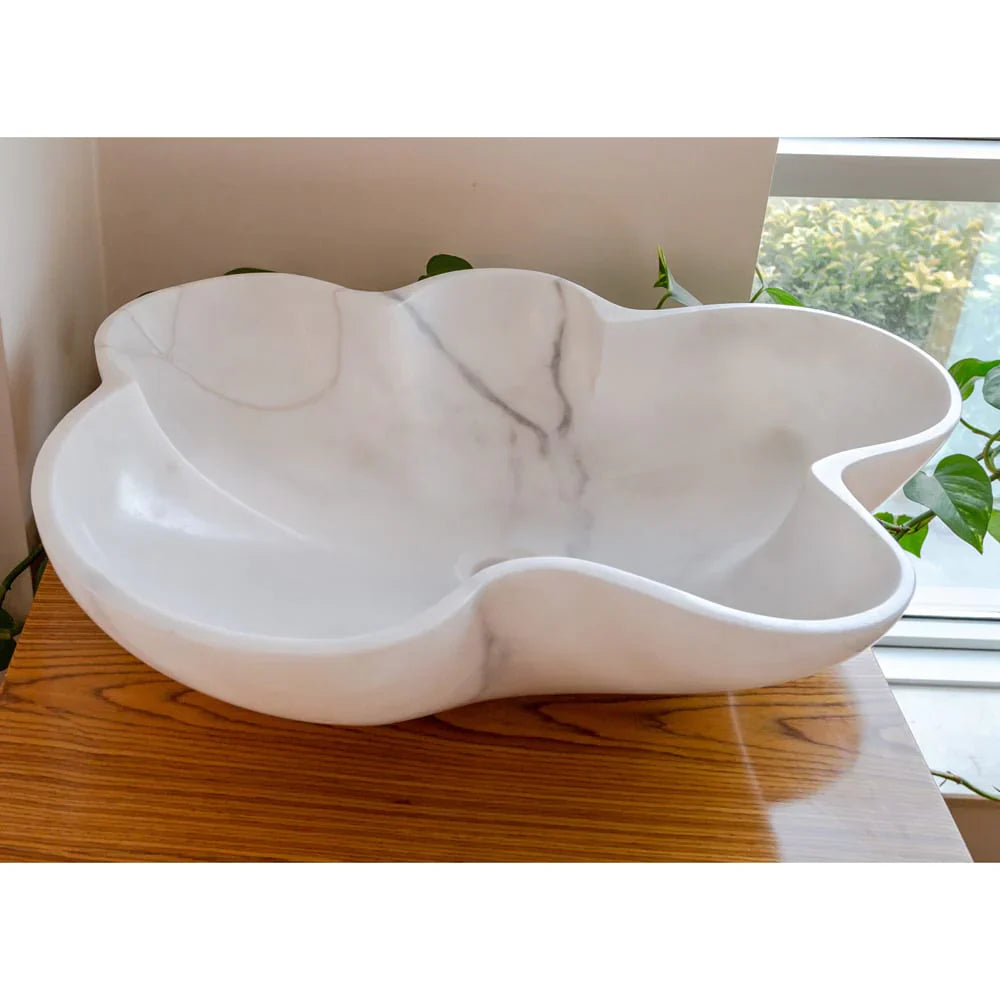 Elegant Carrara white marble vanity sink showcasing timeless luxury and sophisticated bathroom design.