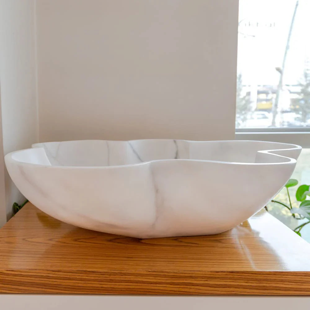 Elegant Carrara white marble vanity sink showcasing timeless luxury and sophisticated bathroom design.
