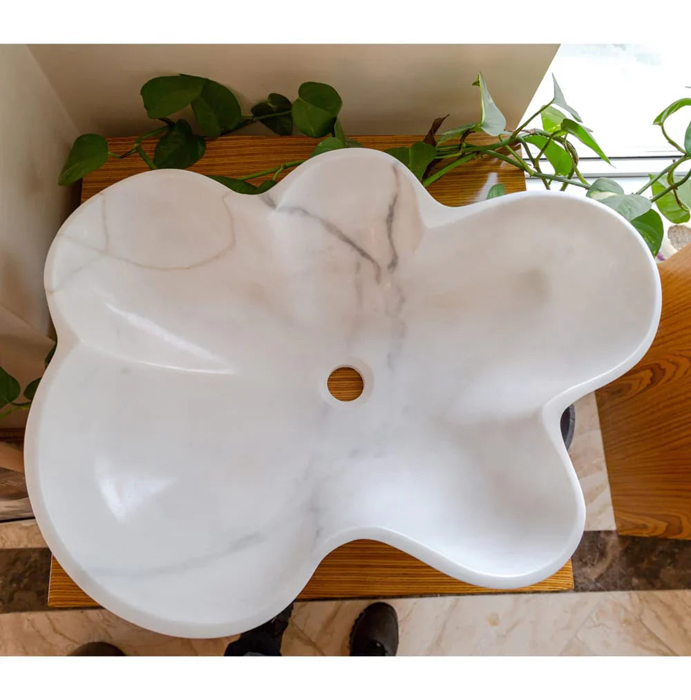 Elegant Carrara white marble vanity sink showcasing timeless luxury and sophisticated bathroom design.
