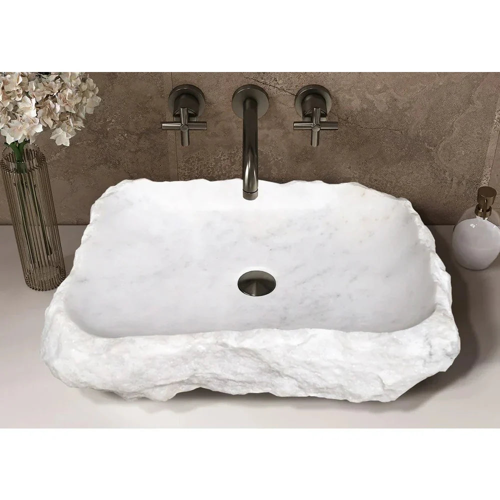 Elegant Carrara Marble surface showcasing rustic charm, perfect for timeless and sophisticated interior design.