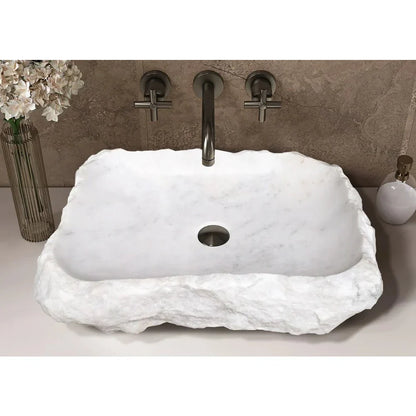 Elegant Carrara Marble surface showcasing rustic charm, perfect for timeless and sophisticated interior design.