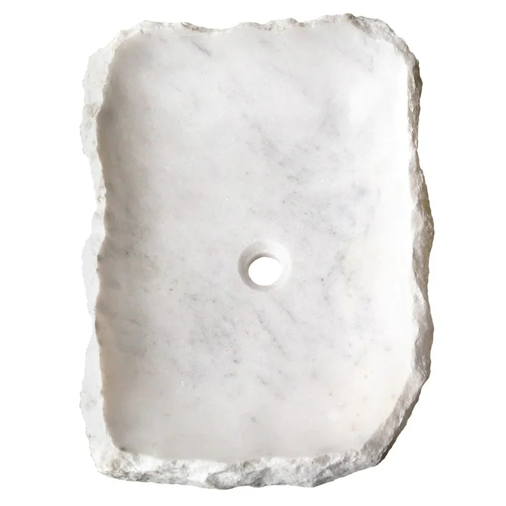 Elegant Carrara Marble surface showcasing rustic charm, perfect for timeless and sophisticated interior design.