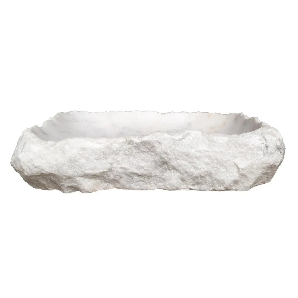 Elegant Carrara Marble surface showcasing rustic charm, perfect for timeless and sophisticated interior design.