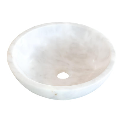 Handcrafted Carrara marble sink with soft white base and gentle gray veining, perfect for luxury bathroom design.