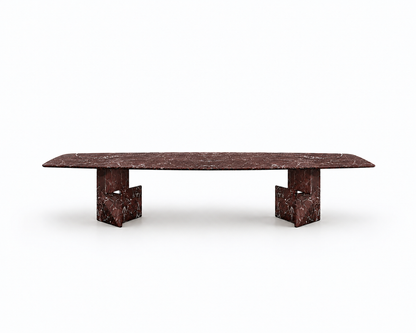 A long rectangular table with a dark reddish-brown marble top and matching sculptural block bases, shown on a clean white background.