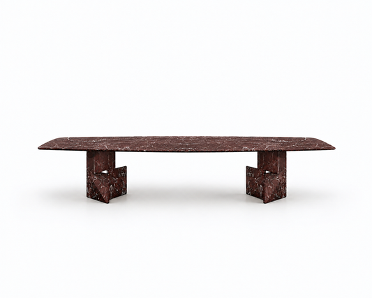 A long rectangular table with a dark reddish-brown marble top and matching sculptural block bases, shown on a clean white background.