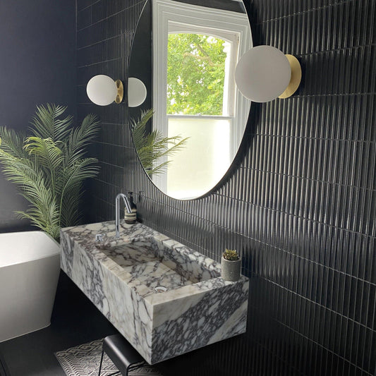 Calacatta Viola marble sink showcasing elegant natural veining and luxurious stone craftsmanship