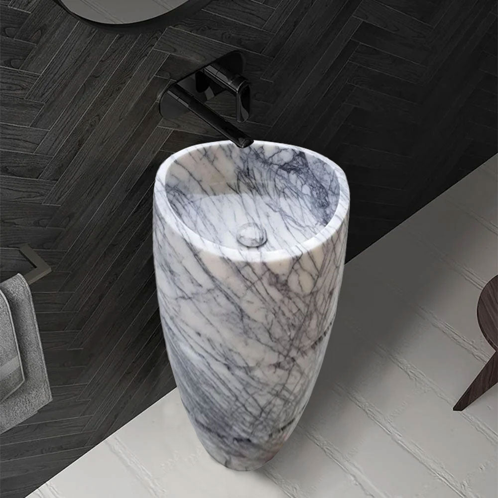 Elegant marble pedestal sink showcasing timeless design and superior craftsmanship for luxurious bathroom aesthetics