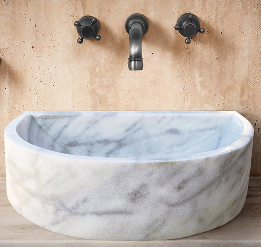 Elegant Carrara White wall-mount sink showcasing modern bathroom design and space-saving functionality