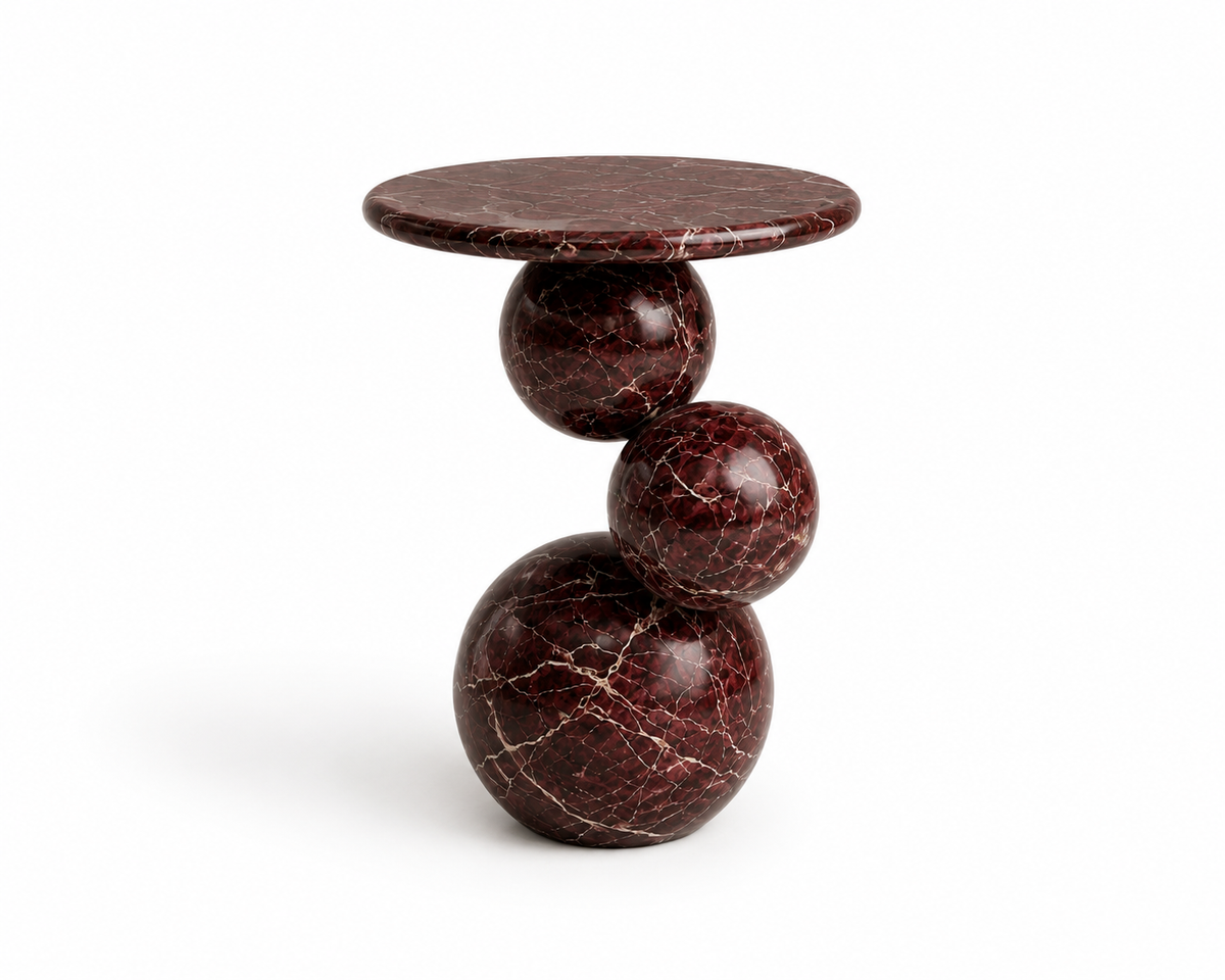Orb Rosso Marble End Table handcrafted from natural red marble with a sculptural round design.