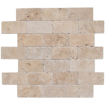 Riverbed scene showcasing smooth travertine stones along the water's edge, highlighting natural textures and serene beauty.