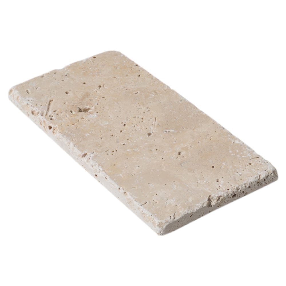 Riverbed scene showcasing smooth travertine stones along the water's edge, highlighting natural textures and serene beauty.