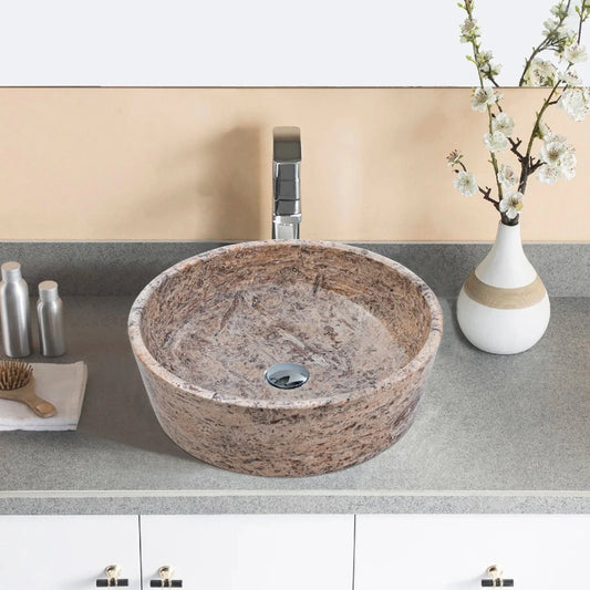 Elegant silver accents complement natural travertine textures in sophisticated interior designs.