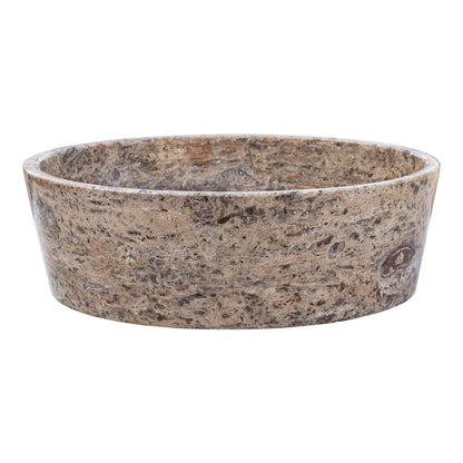 Elegant silver accents complement natural travertine textures in sophisticated interior designs.