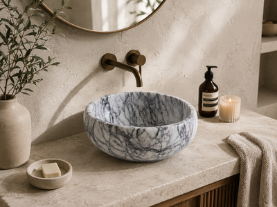 Viola Calacatta Oval Vessel Sink in natural marble — carved from a single block of natural stone, no two pieces alike