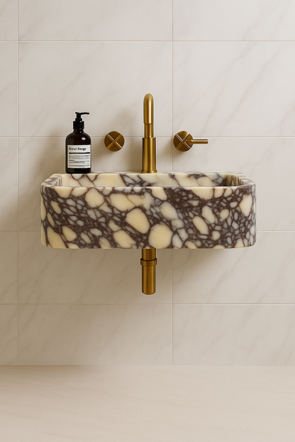Calacatta Viola marble sink with bold veining in rich purples and soft whites, wall-mounted in a luxury bathroom setting.