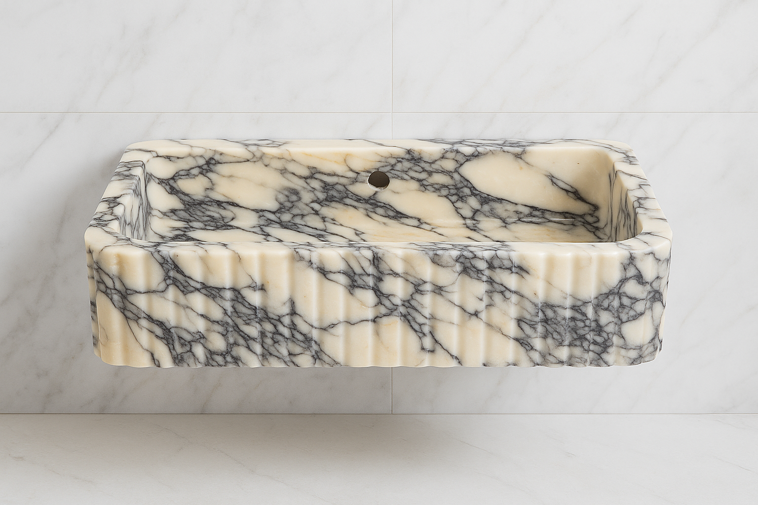 Handcrafted Calacatta Viola marble sink with bold black and white veining, perfect for luxury bathroom decor.