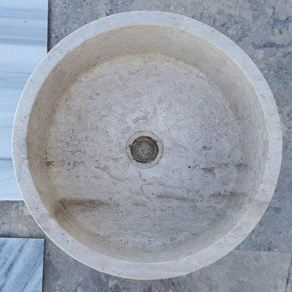 Elegant travertine sink showcasing natural stone texture for luxurious bathroom design and durability