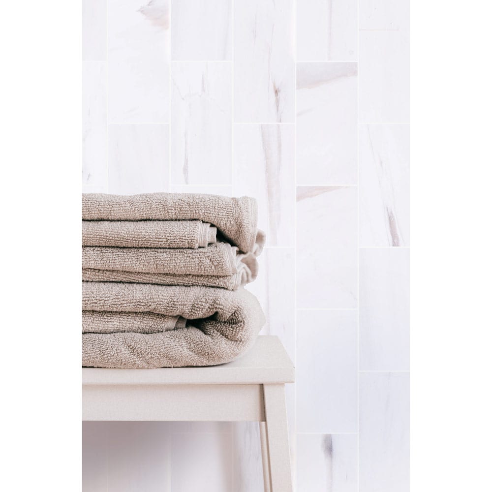 Elegant Bianco Dolomite marble tile showcasing natural stone texture, perfect for sophisticated interior flooring and wall design.