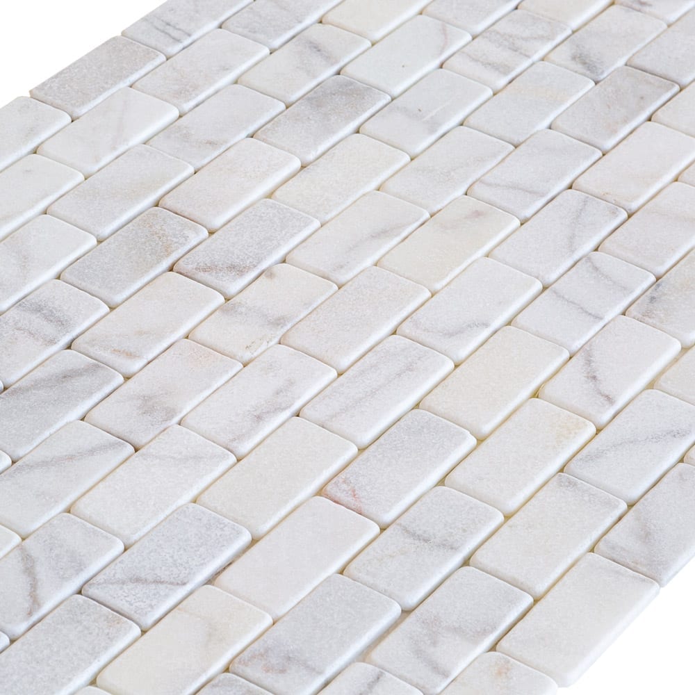 Elegant Bianco marble surface showcasing natural white veining for sophisticated interior design and architectural projects.