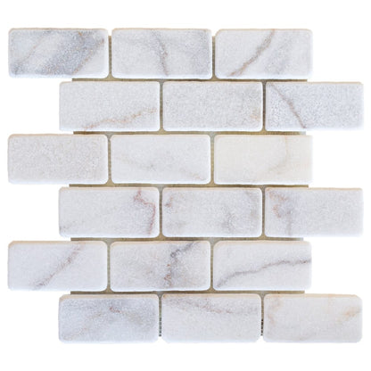 Elegant Bianco marble surface showcasing natural white veining for sophisticated interior design and architectural projects.