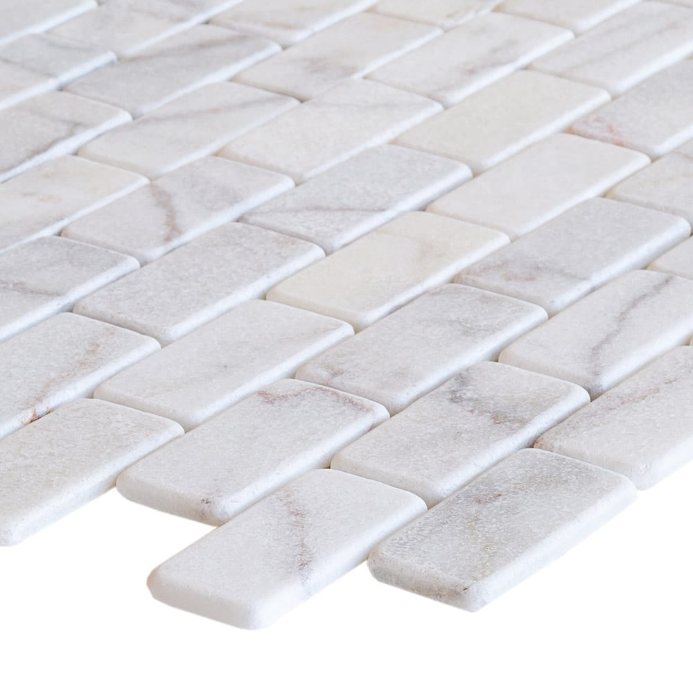 Elegant Bianco marble surface showcasing natural white veining for sophisticated interior design and architectural projects.