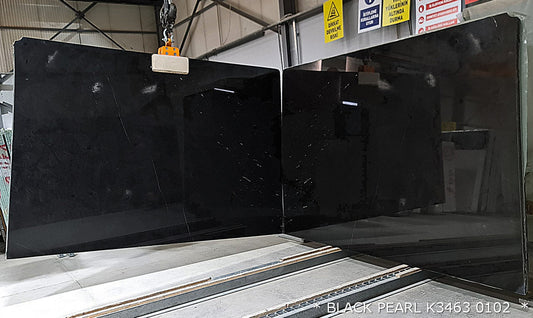 Black Pearl marble slabs showcasing elegant dark hues and natural veining, perfect for luxurious interior designs.