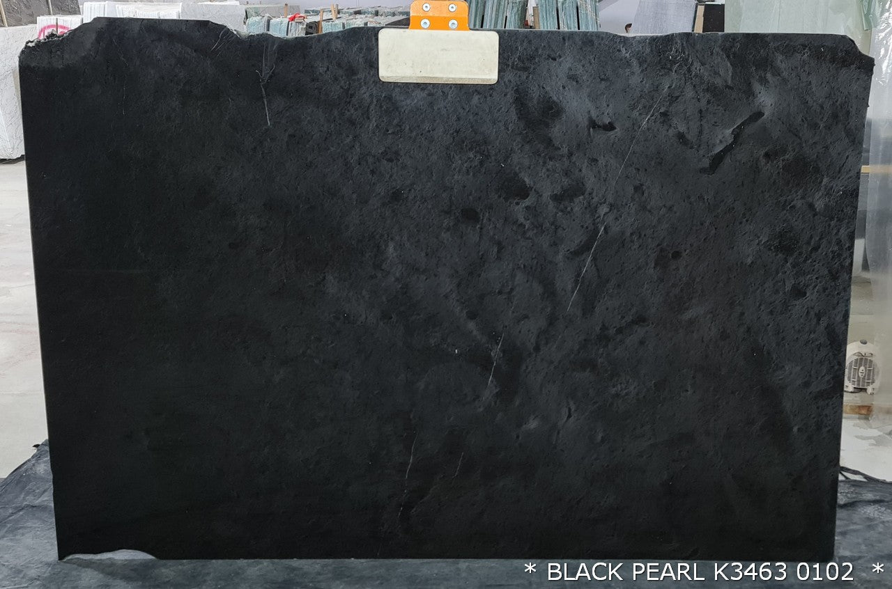 Black Pearl marble slabs showcasing elegant dark hues and natural veining, perfect for luxurious interior designs.