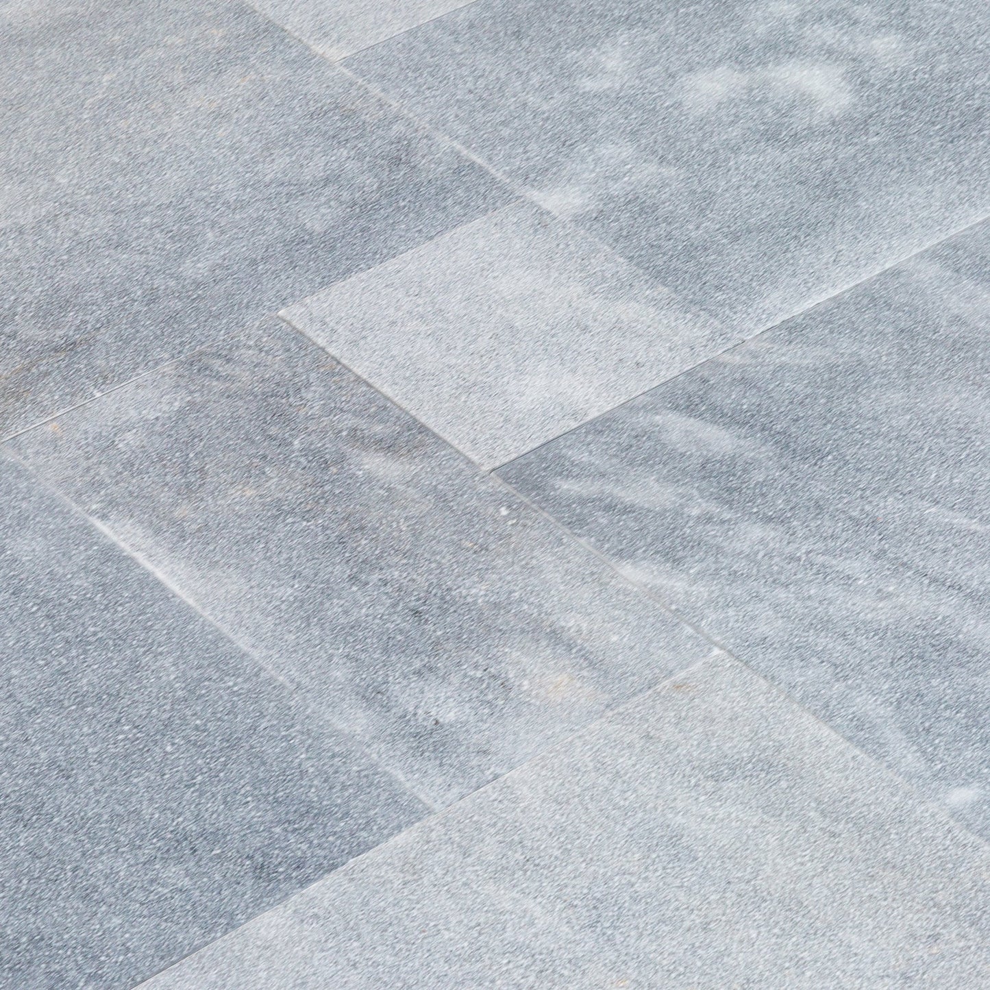 High-quality Bluestone and Marble tiles showcasing elegant natural stone textures for premium interior and exterior design