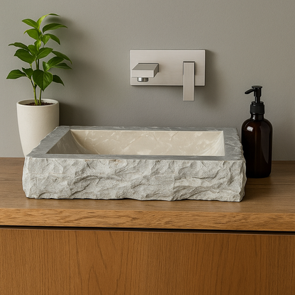 Natural limestone marble vessel sink with polished finish on wooden countertop, showcasing minimalist design.
