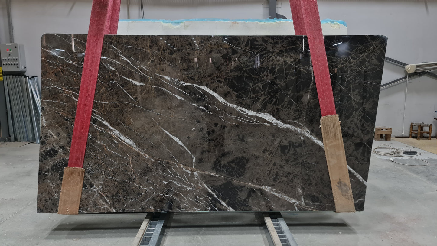 Elegant Bruno Perla design featuring luxurious brown marble surface with polished finish, perfect for upscale interiors.