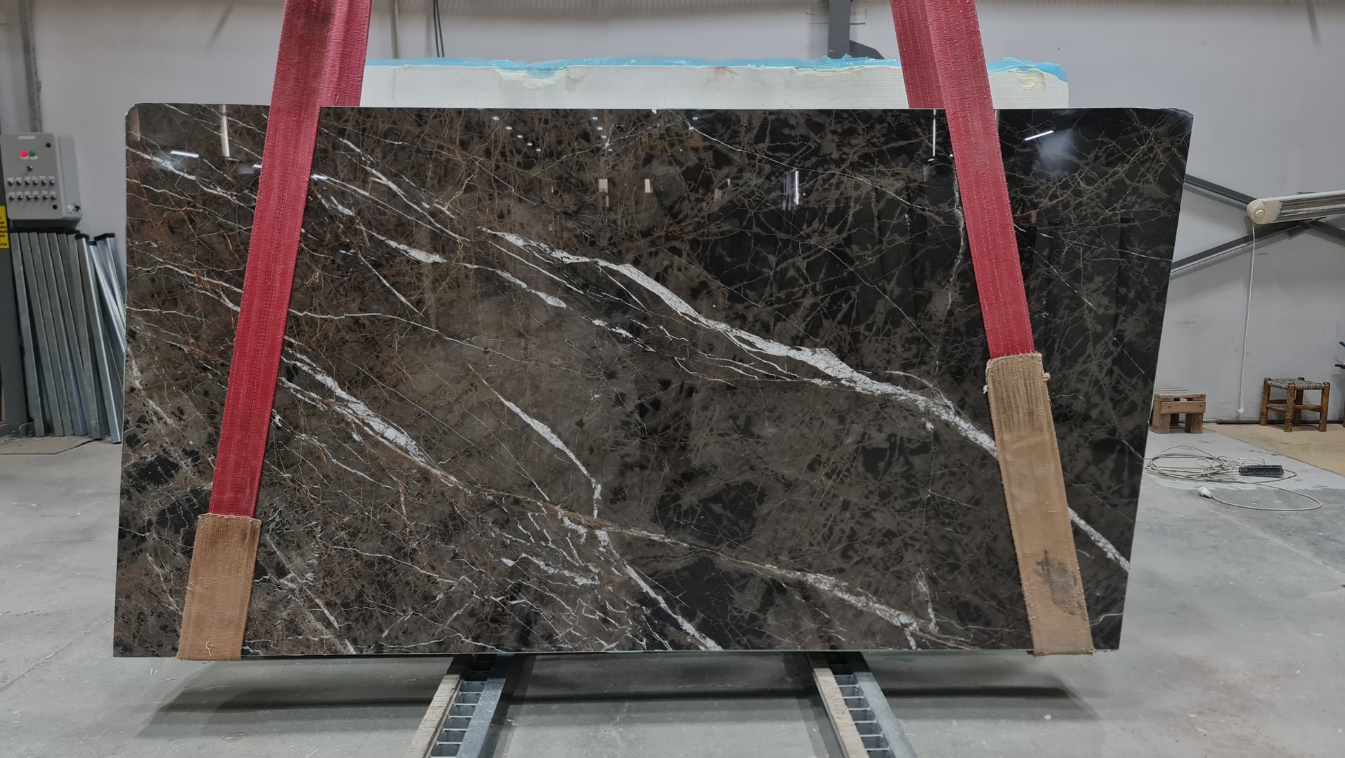 Elegant Bruno Perla design featuring luxurious brown marble surface with polished finish, perfect for upscale interiors.