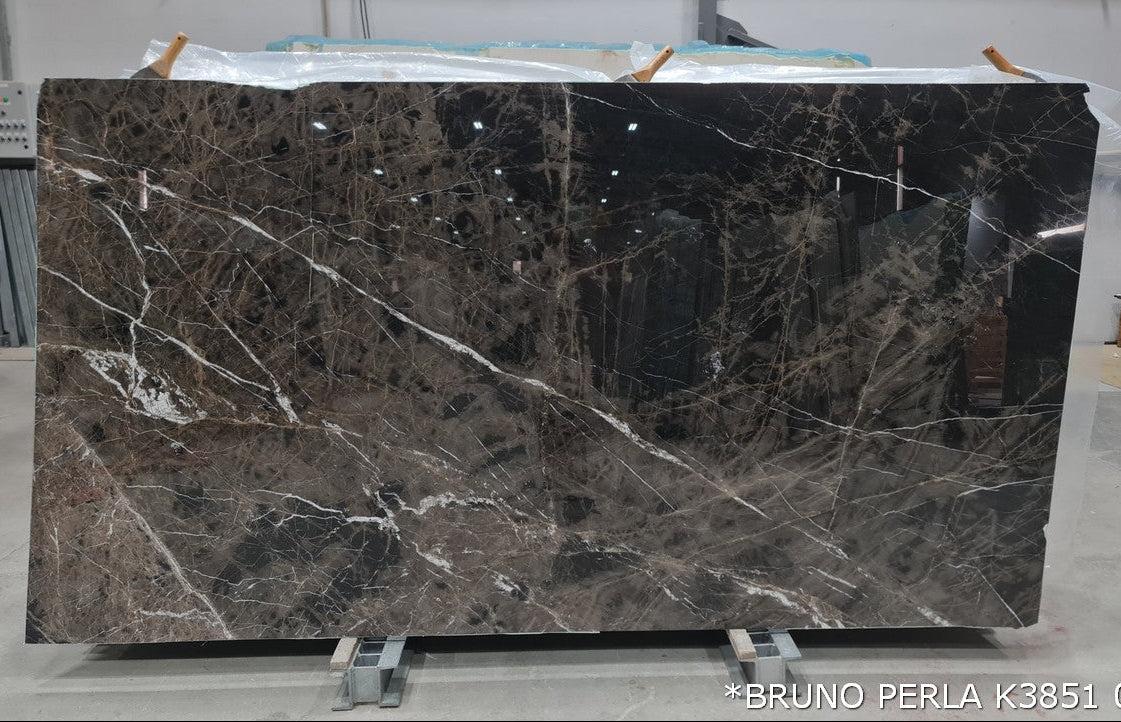 Elegant Bruno Perla design featuring luxurious brown marble surface with polished finish, perfect for upscale interiors.