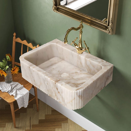 Elegant Calacatta Gold wall-mount vanity sink enhancing bathroom aesthetics with luxurious marble finish