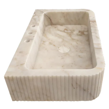 Elegant Calacatta Gold wall-mount vanity sink enhancing bathroom aesthetics with luxurious marble finish