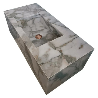 Sleek wall-mount sink featuring elegant Calacatta Verde marble design for modern bathroom aesthetics