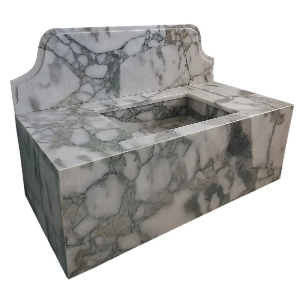 Sleek wall-mount sink featuring elegant Calacatta Verde marble design for modern bathroom aesthetics