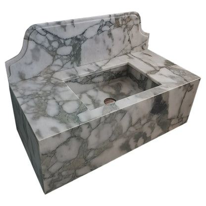 Sleek wall-mount sink featuring elegant Calacatta Verde marble design for modern bathroom aesthetics