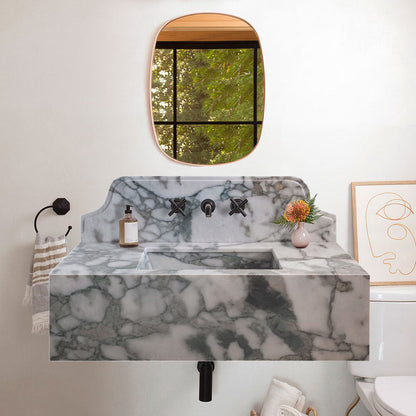 Sleek wall-mount sink featuring elegant Calacatta Verde marble design for modern bathroom aesthetics