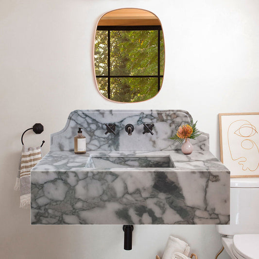 Sleek wall-mount sink featuring elegant Calacatta Verde marble design for modern bathroom aesthetics