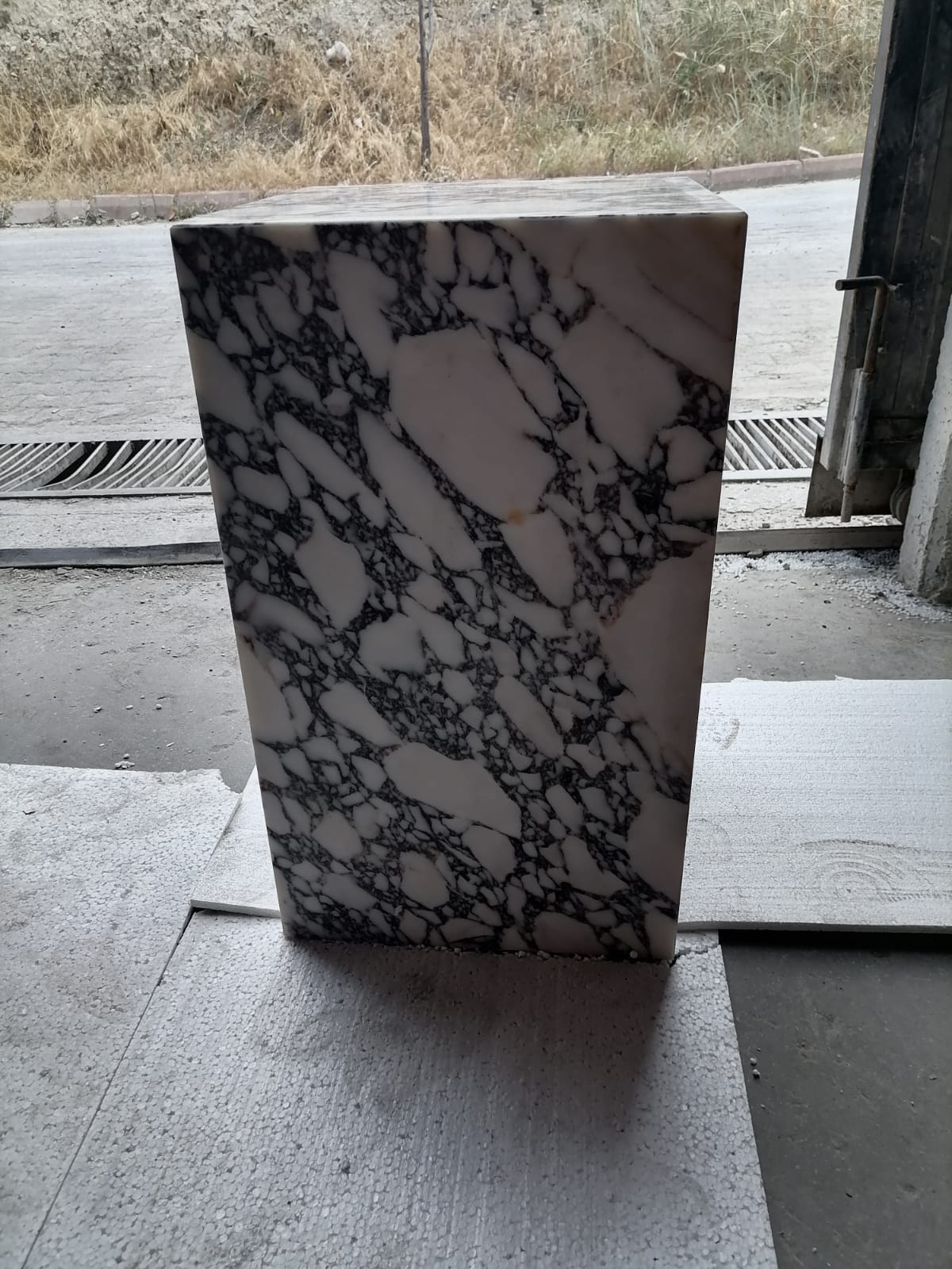 Elegant Calacatta marble nightstand with sleek design, perfect for modern bedroom decor and functional style.