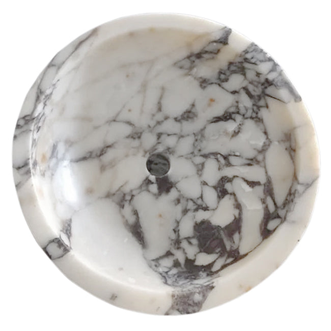 Elegant Calacatta marble surface showcasing natural veining patterns ideal for luxury interior design